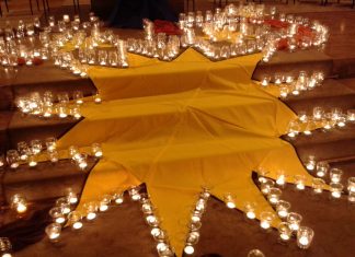 Leuchtende Kerzen sollen ein Zeichen für eine gerechtere Welt setzen. Foto: Caritas