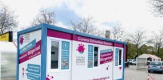 Auf dem Parkplatz von Real steht die Testbox, in der kostenlose Bürgertestungen angeboten werden. Foto: Corona-Schnelltestzentrum Ratingen