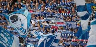 Fans vom VfL Bochum schwenken Flaggen und Schals. Foto: Swen Pförtner/dpa/archivbild - WICHTIGER HINWEIS: Gemäß den Vorgaben der DFL Deutsche Fußball Liga bzw. des DFB Deutscher Fußball-Bund ist es untersagt, in dem Stadion und/oder vom Spiel angefertigte Fotoaufnahmen in Form von Sequenzbildern und/oder videoähnlichen Fotostrecken zu verwerten bzw. verwerten zu lassen.